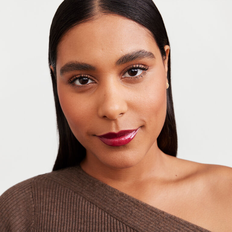 Model wearing Mary Kay fall/holiday makeup artist look Blackberry Vinyl